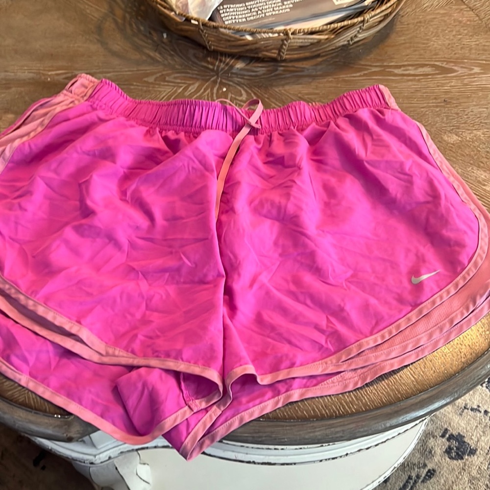 Pink Nike athletic shorts
